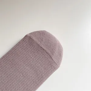Detailed close-up showing the soft knitted texture and fine ribbed pattern of socks.