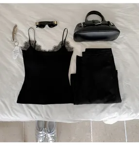 Black lace trim camisole flat lay detail view, featuring elegant thermal inner wear design.