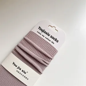 Autumn winter solid color ribbed cotton women mid tube socks with heel, comfortable daily wear.