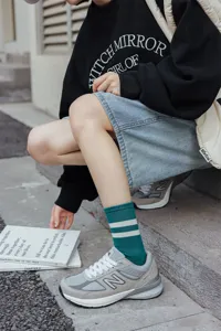Stylish women striped mid-calf socks for autumn and winter daily street wear outfit.