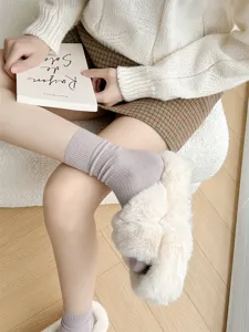 Women's solid color ribbed cotton mid-tube socks with heel, cozy daily wear and winter comfort.