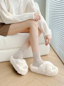 Cozy women's solid ribbed mid-calf cotton socks for autumn and winter, soft and comfortable.