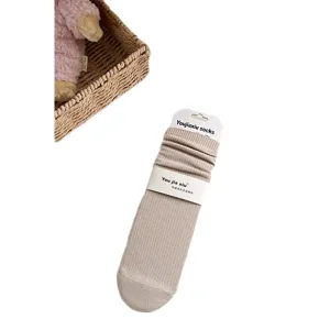 Solid color ribbed cotton women's mid-tube socks with heel in light khaki color, main view.