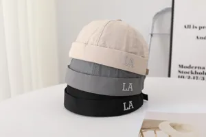 Detail view of summer quick-drying brimless miki hat featuring stylish LA embroidery.