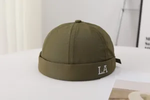 Green docker cap for men, quick-drying breathable miki hat with LA letter embroidery detail.