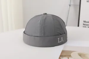 Stylish gray docker cap for men with LA letter embroidery, quick-dry summer streetwear hat.