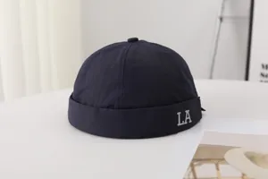 Men's quick-drying docker cap solid color roll-up fisherman hat with stylish LA letter.