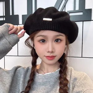 Winter warm knitted beret for women, classic black chic painter hat, sweet daily fashion accessory.