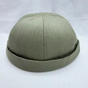 Grüne Fischgräten Dockman Mütze Detail, lässige schirmlose Miki Cap für stilvollen Sommer Look.