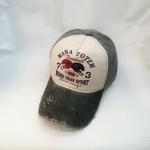 Distressed washed baseball cap with vintage football print and curved brim for casual wear.