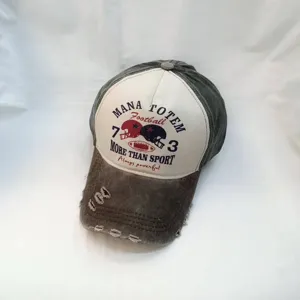 Washed distressed baseball cap with retro letter print and football graphic, casual street style.