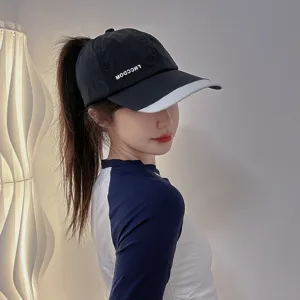 Detailed view of the quick-drying sun protection baseball cap designed for high ponytails.