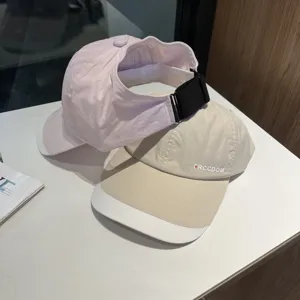 Detailed view of quick-drying summer sun protection baseball caps stacked neatly.