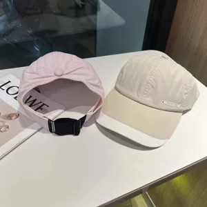 Detail view of summer quick-drying baseball caps, featuring ponytail and sun protection designs.
