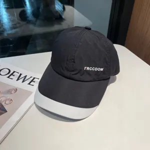 Classic black and white baseball cap with quick-drying fabric and chic front lettering.