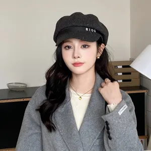 Grey wool newsboy hat for women, retro octagonal cap with chic letter strap for autumn.