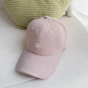 Pink baseball hat for women with curved brim and embroidered LA letters, stylish casual headwear.