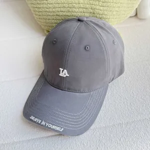 Grey baseball cap for women with LA embroidery, casual curved brim street style hat.