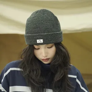 Dark gray knitted beanie detail, warm thick pullover winter hat for women daily casual wear.