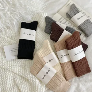 Cozy thick cable knit mid-tube women socks in Maillard colors, warm winter slouch socks detail.