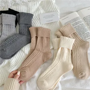 Thick cable knit slouch socks for women, cozy winter warm mid-calf hosiery details view.
