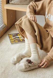 Cozy autumn winter women fuzzy slippers and ribbed knit warm slouch socks for daily wear.
