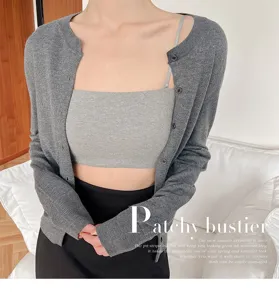 Detailed shot of women's ribbed knit cardigan and bustier set in stylish grey color.