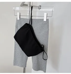 Detailed view of the black ribbed stretch cotton bandeau top, showing texture and design.