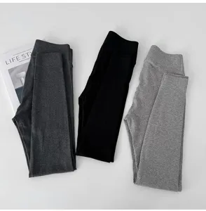 High-waist ribbed leggings detail view, showing high elasticity and soft cotton-blend texture.