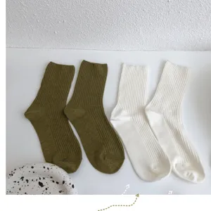 Autumn winter solid color ribbed mid tube cotton socks for women, simple comfortable daily wear.
