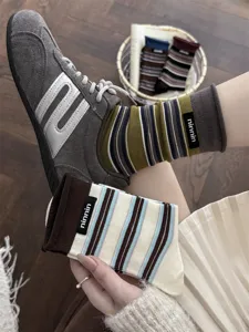 Retro striped cuffed cotton mid-calf socks with chic fabric label for women autumn daily wear.