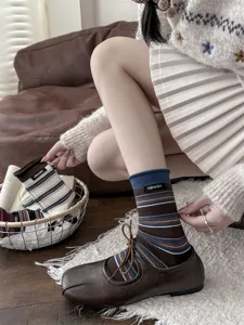 Retro striped cotton mid-calf socks with fabric tag, detail shot showing autumn winter style women hosiery.