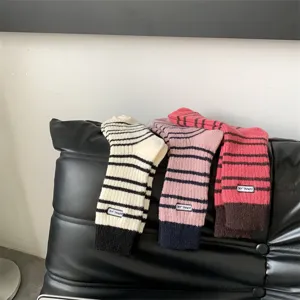 Thick warm striped wool-blend knit women socks, cozy mid-calf winter casual hosiery.