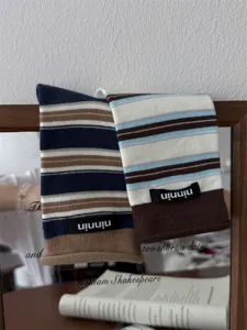 Women retro striped cotton mid-tube slouch socks with fabric label roll edge detail view
