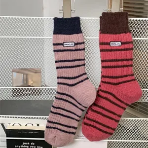 Thickened warm striped knit socks for women, autumn and winter cozy mid-tube woolen style.