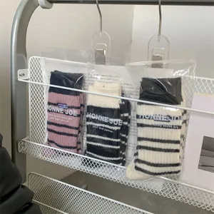 Thickened striped winter warm knit socks in detail view, cozy casual everyday wear.
