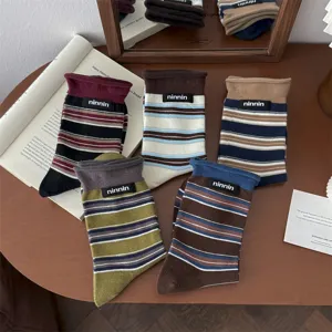 Retro striped cotton mid-tube slouch socks with cloth label, comfortable autumn winter wear.