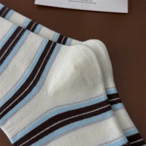 Close-up of retro striped cotton mid-tube socks, soft texture and vintage color design.