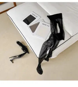 Black sheer polka dot pantyhose for women, lightweight hosiery for spring and summer.