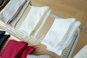 Detail shot of cozy ribbed cotton mid-tube stack socks in warm colors for women autumn.