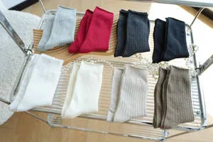 Detail view of Japanese style ribbed cotton mid tube women socks in versatile Maillard colors.