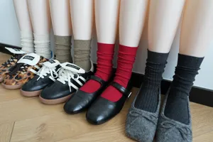 Multi-color mid-tube stacked cotton socks with plain and ribbed designs for everyday wear.