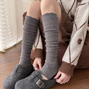 Grey knit stirrup leg warmers for women, cozy winter thermal long socks for daily wear.