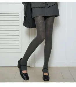 Close-up view of grey wide ribbed stirrup tights detail, showing soft cotton texture and fit.