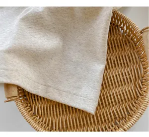 Close-up of soft ribbed knit fabric texture, perfect detail view for summer camisoles.