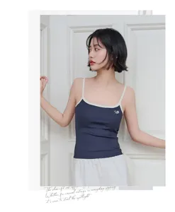Modal contrast strap camisole featuring built-in chest pad and delicate embroidery detail.