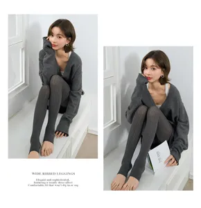 Detail view of dark grey wide ribbed stirrup leggings showing soft texture and comfortable fit.
