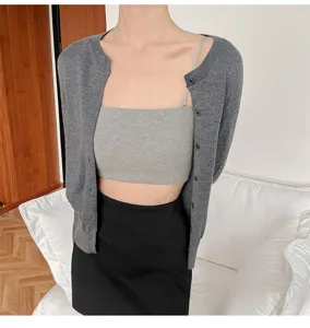 Grey knitted cardigan and ribbed tube top detail showing comfortable daily wear and fit.