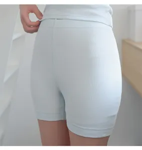Close-up detail of light blue ribbed safety shorts, soft cotton fabric texture view.