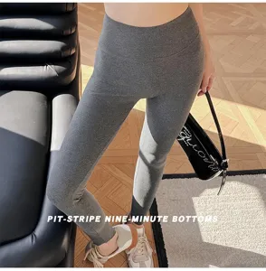 High-waist grey ribbed leggings for women, stretch knit yoga nine-minute trousers detail.